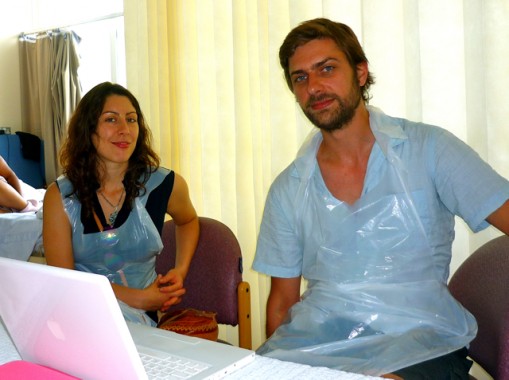 P1030146 Lori and Andy who drove me to Sutton. Visitors need to wear these charming plastic aprons when they enter in to our bay/room.